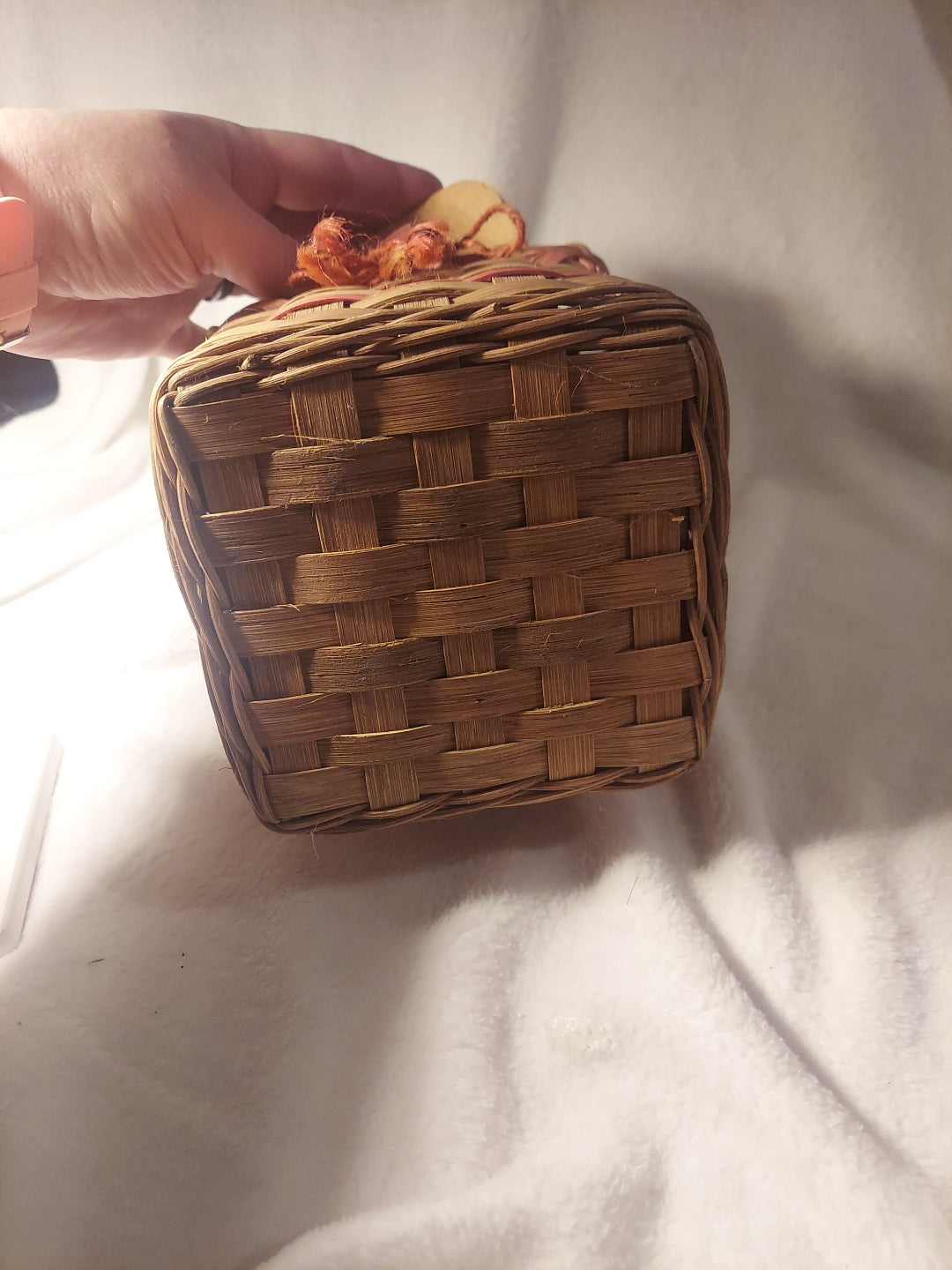 Vintage wicker tissue box with wooden lid and red accents